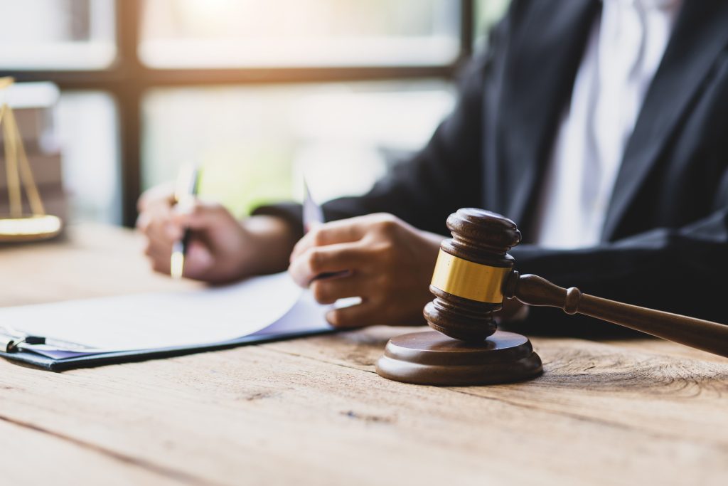 Lawyer looking through paperwork in office